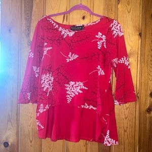 gently used Kauluae Flowy top. front is shorter than back size medium